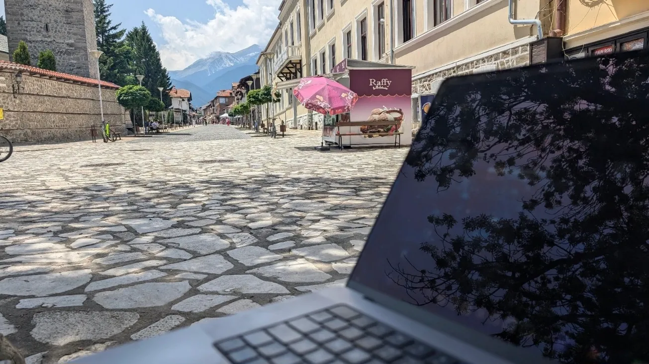 The main street of Bansko and a laptop.